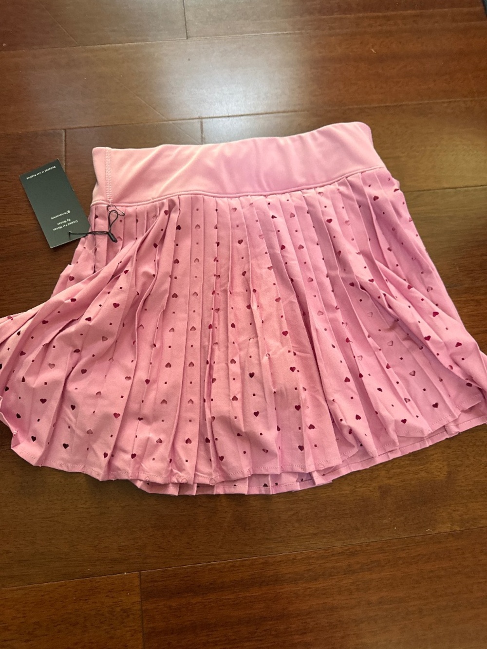 Lady’s small new with tags tennis skirt with pink hearts